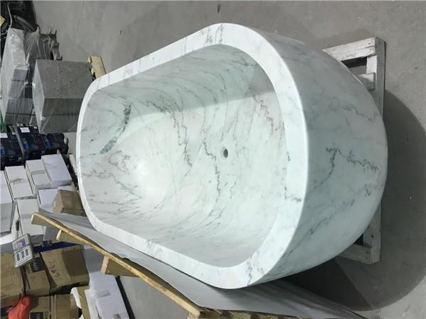 white marble oval bathtub